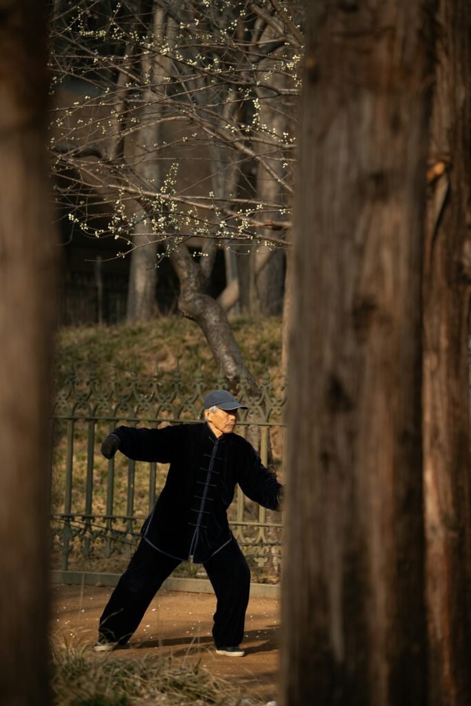 Elderly person practicing tai chi in a park — Photo by Ahmed Nishaath on Unsplash (Unsplash License)